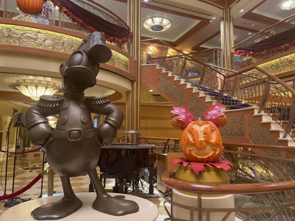 Disney Halloween on the High Seas Cruise - a bronze donald duck statue in the cruise