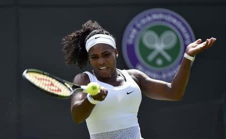 Serena Williams of U.S.A. plays a shot during her match against Margarita Gasparyan of Russia at the Wimbledon Tennis Championships in London, June 29, 2015. REUTERS/Toby Melville