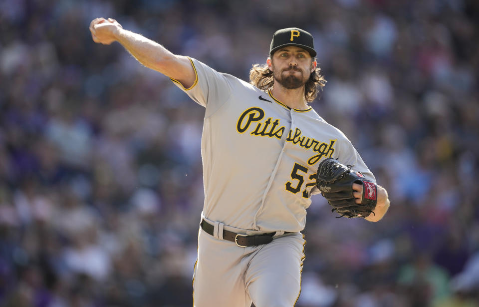 Pittsburgh Pirates relief pitcher Clay Holmes turns to make a pickoff throw against the Colorado Rockies in the sixth inning of a baseball game Monday, June 28, 2021, in Denver. (AP Photo/David Zalubowski)