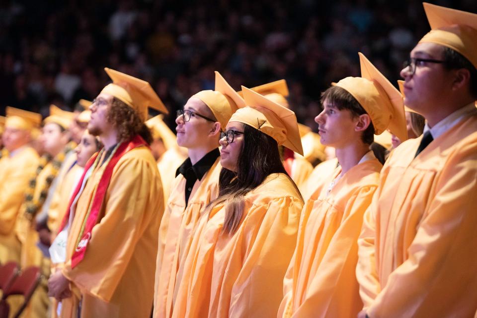 Pueblo East High School graduates wait to be seated at the start of their commencement ceremony on Friday, May 26, 2023.