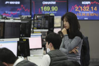 Currency traders watch monitors at the foreign exchange trading room of the KEB Hana Bank headquarters in Seoul, South Korea, Tuesday, Feb. 4, 2020. Shares advanced in Asia on Tuesday, with the Shanghai Composite up 0.2% after a rebound on Wall Street overnight. (AP Photo/Ahn Young-joon)