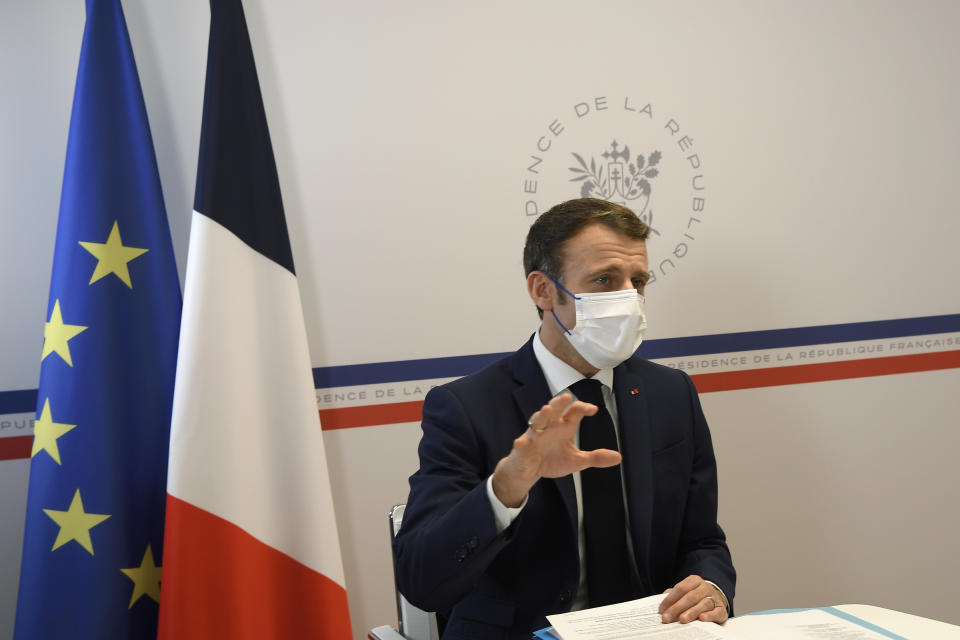 France's President Emmanuel Macron leads a special cabinet meeting from the Fort de Bregancon presidential holidays residence, in Bormes-les-Mimosas, southern France, Monday, Dec. 21, 2021. Macron held a special virus meeting on Monday with some key ministers via video call from his holiday residence at Fort de Bregancon, on the French Riviera, after the country recorded more than 100,000 virus infections in a single day for the first time in the pandemic. (Nicolas Tucat, Pool Photo via AP)