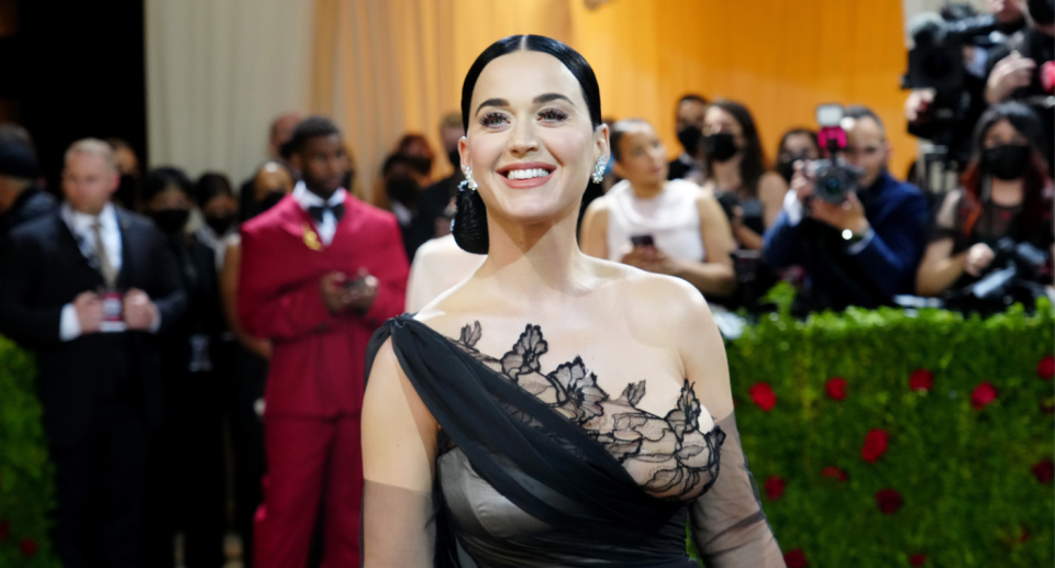 katy perry smiling in black oscar de la renta dress at 2022 met gala in new york