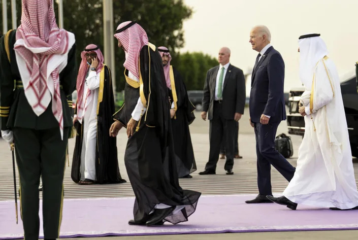 President Joe Biden, center, is greeted by dignitaries as he arrives at King Abdulaziz International Airport in Jeddah, Saudi Arabia, on Friday, July, 15, 2022. (Doug Mills/The New York Times)