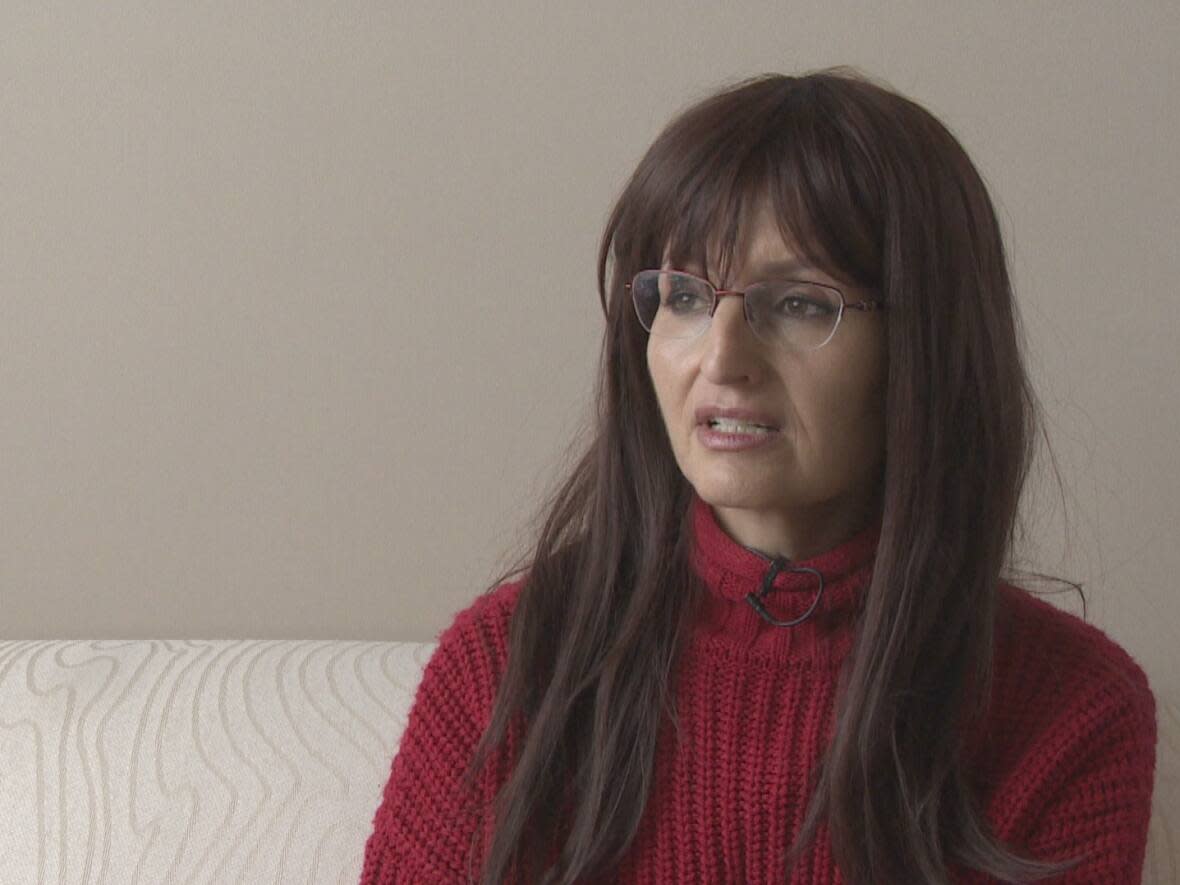 Saskatoon resident Rana Mustafa is originally from Syria. She said she was able to confirm family members were safe right after the earthquake Monday, but has lost contact with them since due to power and internet outages.  (CBC News - image credit)