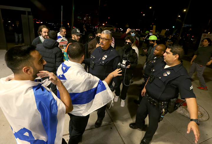 LAPD officers attempt to deescalate a brawl between pro- and anti-Israel supporters 