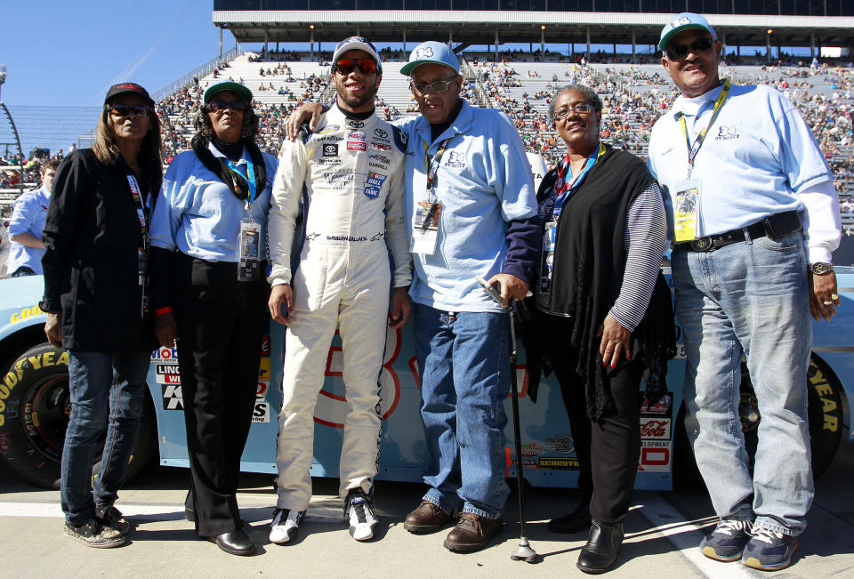 Sybil Scott, Janis Davis, Wendell Scott, Cheryl Ashley and Frank Scott pose with Darrell Wallace Jr., driver of the #34 2015 NASCAR Hall of Fame Inductee Wendell Scott Toyota, during pre-race ceremonies for the NASCAR Camping World Truck Series (Brian Lawdermilk / Getty Images file)