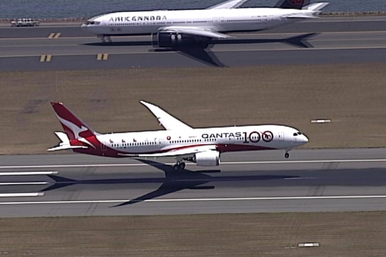 Touch down! The Qantas Boeing 787 Dreamliner plane lands at Sydney airport on Friday: AP