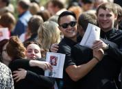 Friends celebrate the life of Josh Hunter after his funeral in Calgary, Alberta April 21, 2014. Matthew de Grood has been charged with killing Hunter and four of his friends at a house party in Calgary's worst mass murder in the history of the city, according to local media reports. REUTERS/Todd Korol (CANADA - Tags: CRIME LAW OBITUARY)