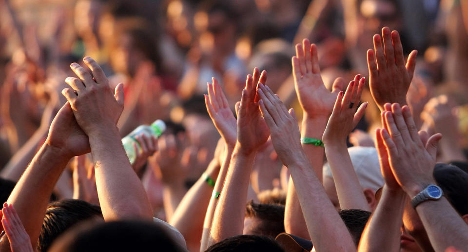 Hands in the air at a concert.