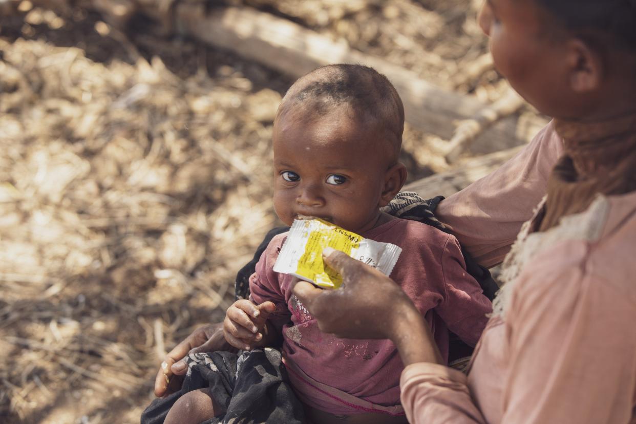 This picture from the World Food Program on Tuesday, Nov. 2, shows a mother giving supplementary nutrition products to her 6-month-old daughter in southern Madagascar. International agencies warn that more than 1.1 million people in southern Madagascar urgently need food aid. (Tsiory Ny Aina Andriantso/WFP via AP)