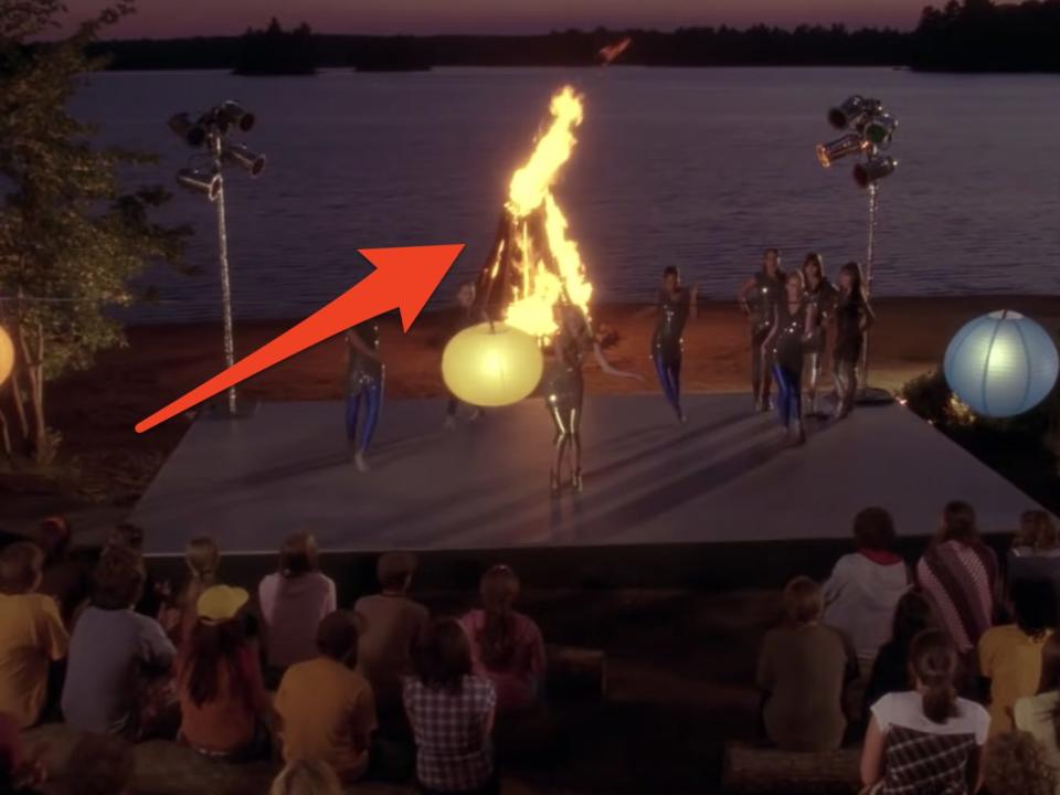 camp rock campfire jam scene with arrow pointing at bon fire