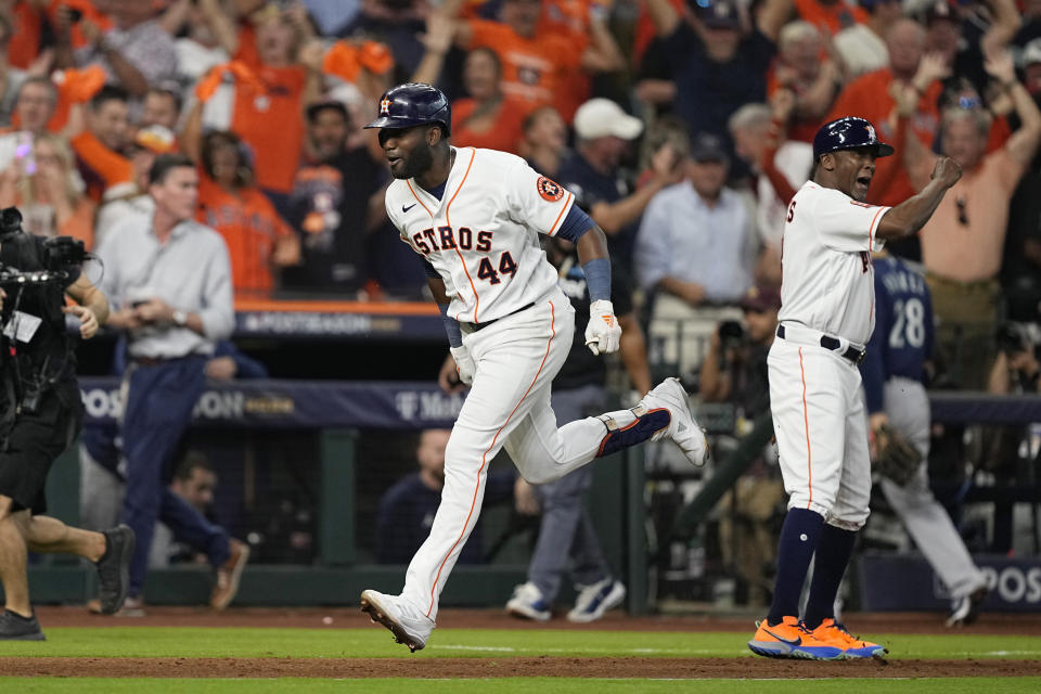 Houston Astros designated hitter Yordan Alvarez (44) celebrates with teammates after his three-run, walkoff home run against the Seattle Mariners during the ninth inning in Game 1 of an American League Division Series baseball game in Houston,Tuesday, Oct. 11, 2022. (AP Photo/David J. Phillip)