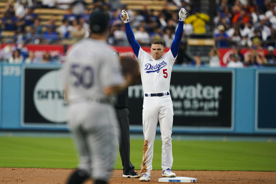 Los Angeles Dodgers' Freddie Freeman (5) celebrates after hitting a double during the first inning of a baseball game against the Colorado Rockies, Thursday, Aug. 10, 2023, in Los Angeles. (AP Photo/Ryan Sun)