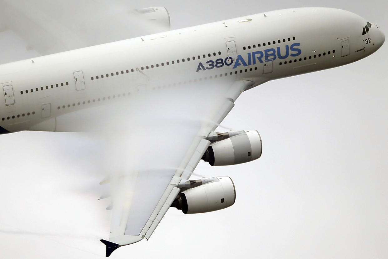 Vapor forms across the wings of an Airbus A380 as it performs a demonstration flight at the Paris Air Show, Le Bourget airport, north of Paris in 2015.