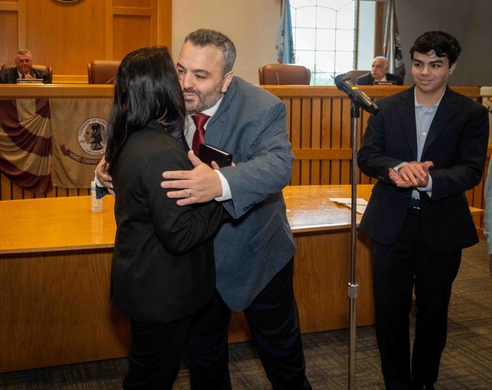 Daniel Rodrick hugs his wife, Diana, after taking the oath of office as Toms River's Mayor on Jan. 1, 2024. His son, Daniel, and daughter, Samantha, look on.