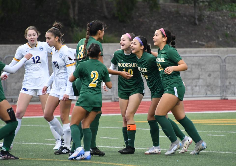 Moorpark players celebrate a goal during their 3-2 win over Upland-Western Christian in a CIF-State Southern California Division III regional quarterfinal match Tuesday at Moorpark High.