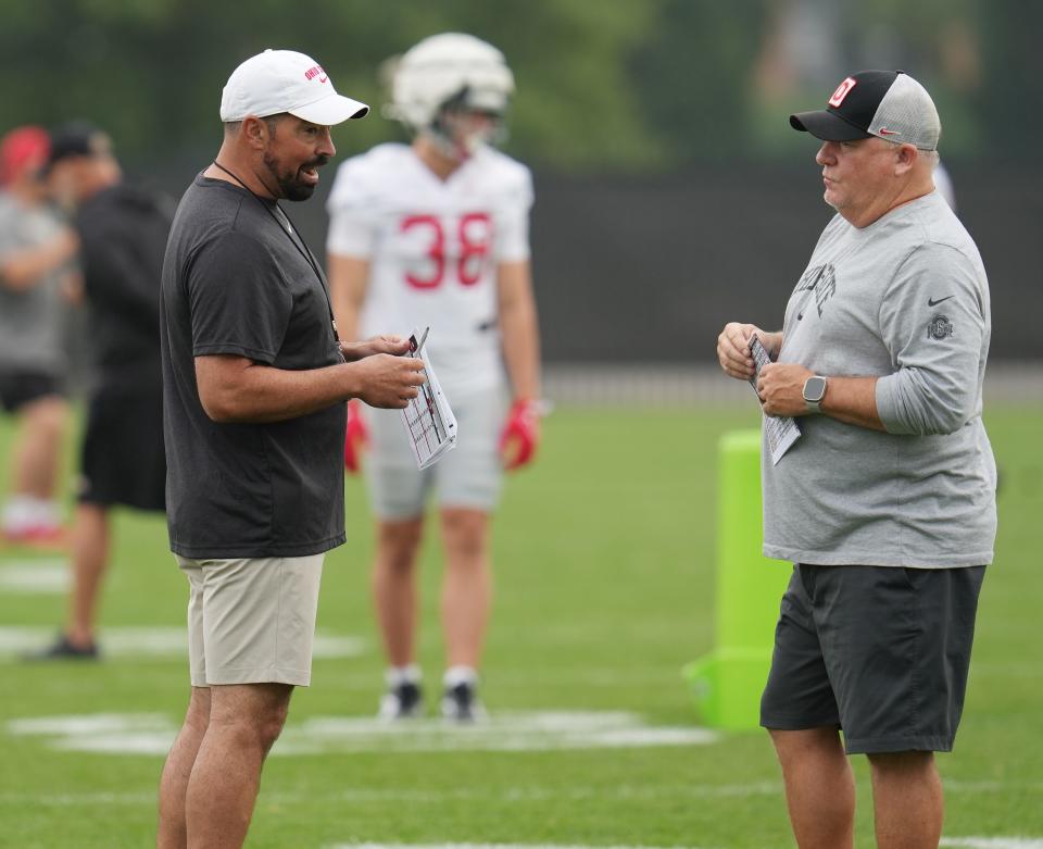 Aug 2, 2024; Columbus, Ohio, USA; Ohio State Buckeyes head coach Ryan Day talks with Offensive Coordinator Chip Kelly during Fall Camp practice Aug. 2, 2024 at the Woody Hayes Athletic Center.