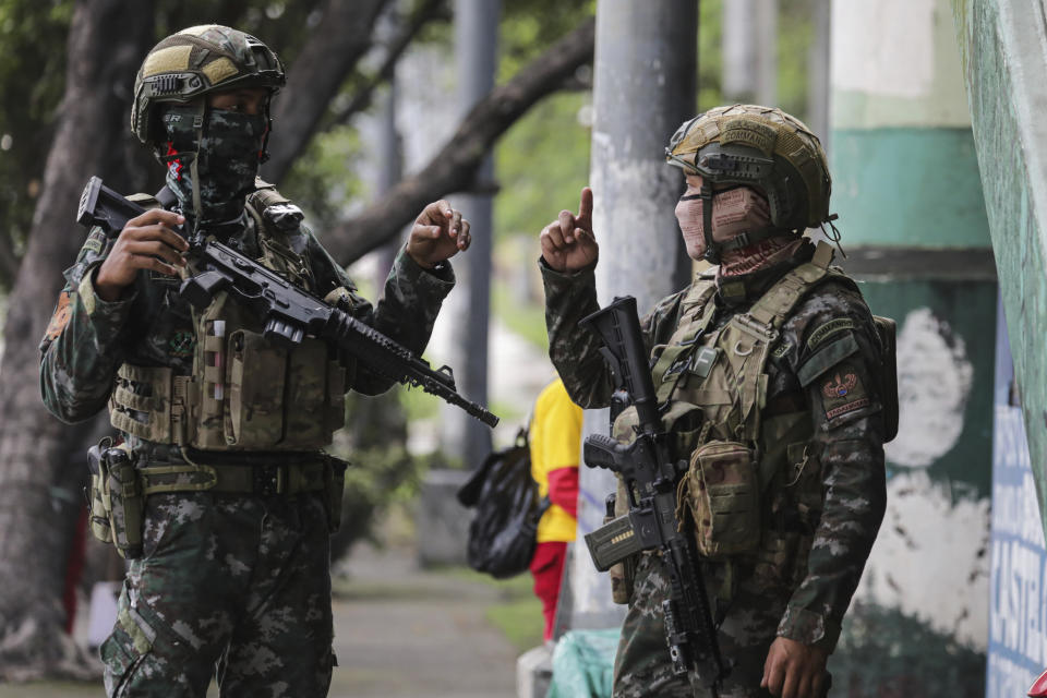 Special Action Forces (SAF) secure the main road and footbridges along the main road leading to the House of Representatives Congress in Quezon City, Philippines ahead of the State of the Nation address Monday, July 25, 2022. Philippine President Ferdinand Marcos Jr. will deliver his first State of the Nation address Monday with momentum from his landslide election victory, but he's hamstrung by history as an ousted dictator’s son and daunting economic headwinds. (AP Photo/Gerard Carreon)