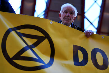 Phil Kingston, 83, takes part in a demonstration blocking the traffic at Canary Wharf Station, during the Extinction Rebellion protest in London, Britain April 25, 2019. REUTERS/Dylan Martinez