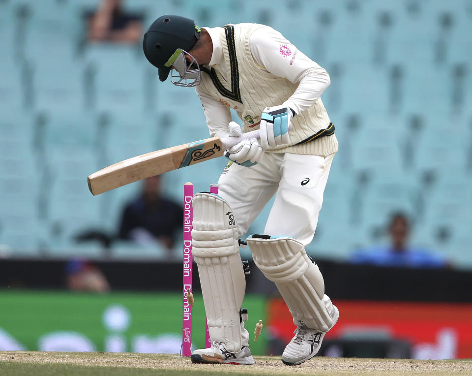 Australia's Peter Handscomb is bowled by India's Jasprit Bumrah on day 4 of their cricket test match in Sydney, Sunday, Jan. 6, 2019. (AP Photo/Rick Rycroft)
