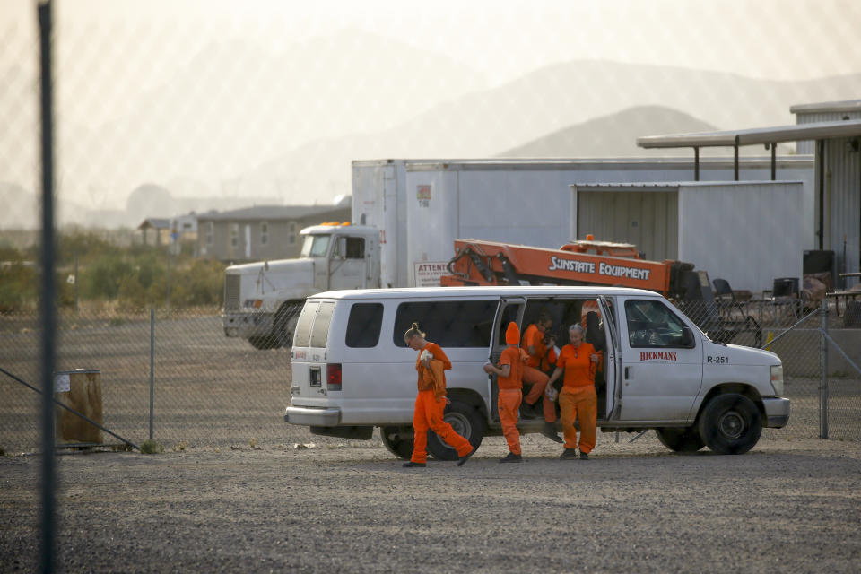 Prisoners serving time at the Arizona State Prison Complex – Perryville arrive at the gates of a Hickman's Family Farms egg ranch, Wednesday, April 19, 2023, in Arlington, Arizona. Hickman's has employed thousands of prisoners for nearly 30 years and supplies many grocery stores, including Costco and Kroger, marketing brands such as Egg-Land's Best and Land O' Lakes. It is the state corrections department's largest private labor contractor, bringing in nearly $35 million over the past six fiscal years. (AP Photo/Dario Lopez-Mills)