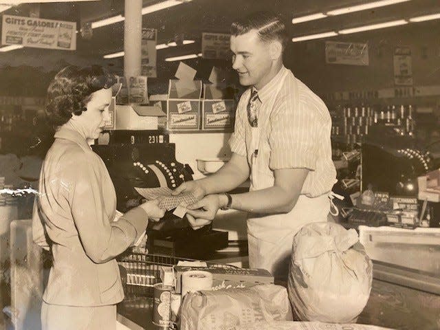 This undated photo shows Joe Shuttlesworth working at Furrs grocery store.