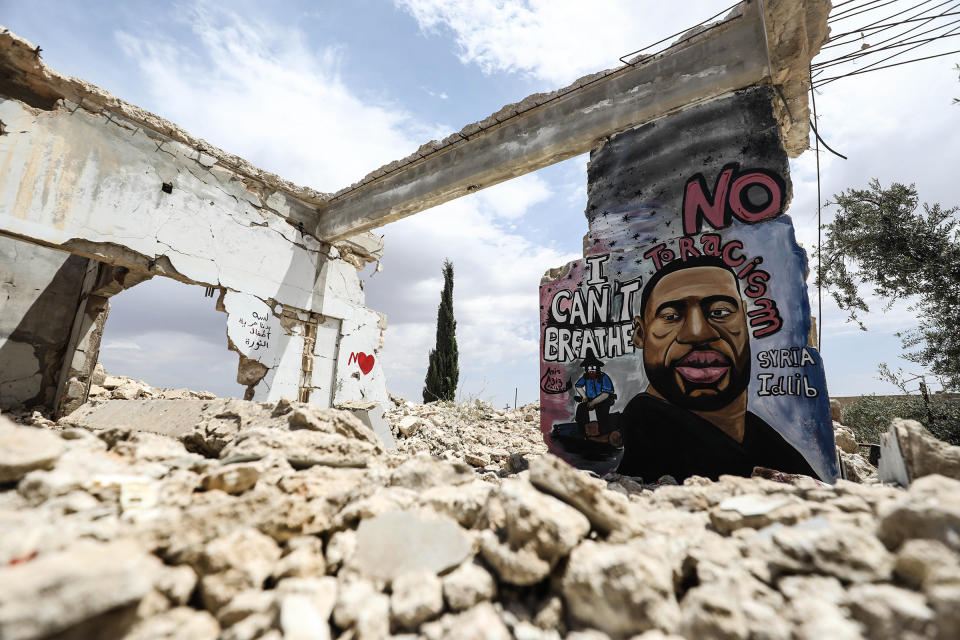 A mural depicting Floyd by graffiti artist Aziz Asmar is seen on a wall of house ruins in the Binnish district of Idlib province, Syria, on June 2, 2020.<span class="copyright">Izzeddin Idilbi—Anadolu Agency/Getty Imagesy</span>