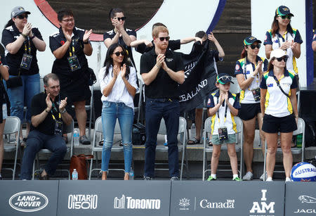 Britain's Prince Harry and his girlfriend actress Meghan Markle watch the wheelchair tennis event during the Invictus Games in Toronto, Ontario, Canada September 25, 2017. REUTERS/Mark Blinch