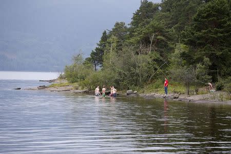 Youths take a morning bath before the opening of Utoya Island, Norway, August 7, 2015. REUTERS/Vidar Ruud/NTB Scanpix