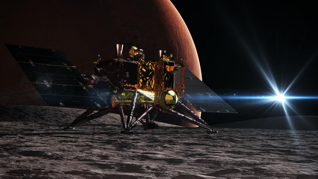  A gold-foil-covered spacecraft on the surface of a rocky moon. 