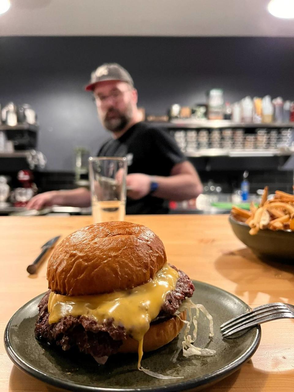 The burger made by chefs Wyatt Sarbacker and Aaron Withers with dry-aged Kentucky beef is available at Favor behind Arcadium.