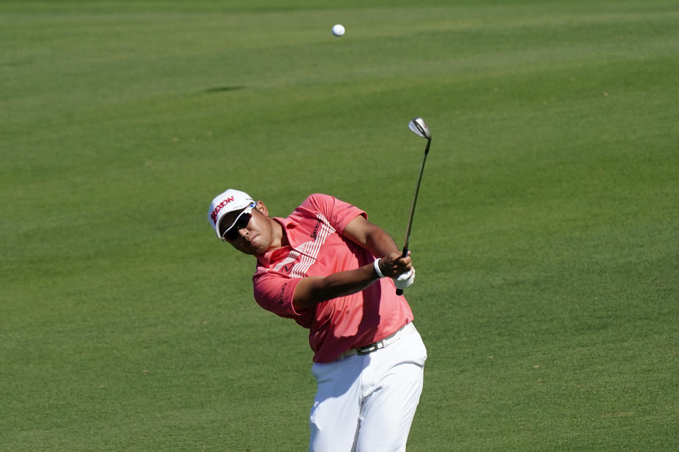 Hideki Matsuyama, of Japan, hits from the 12th fairway during the second round of the Tournament of Champions golf event, Friday, Jan. 7, 2022, at Kapalua Plantation Course in Kapalua, Hawaii. (AP Photo/Matt York)