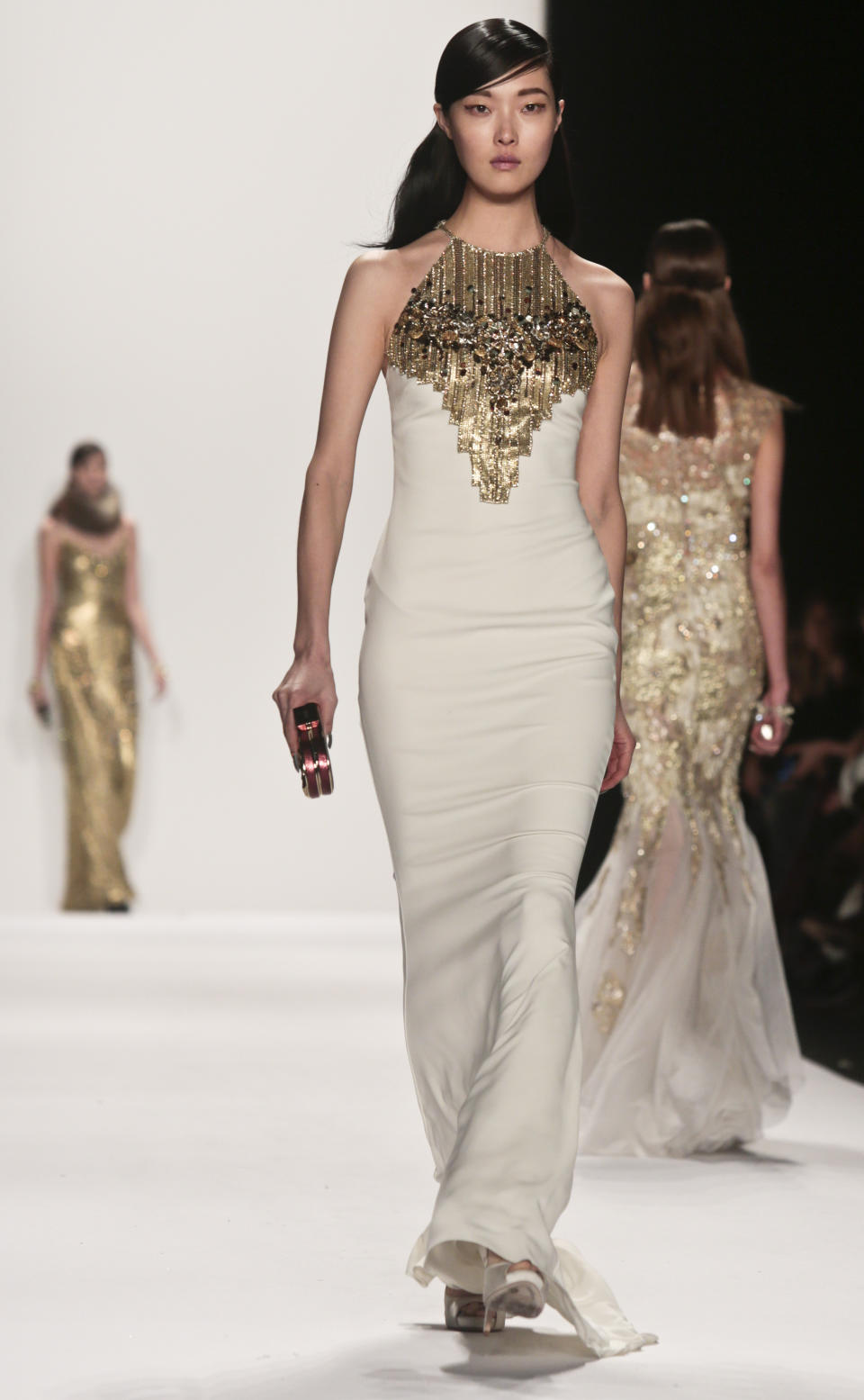 Fashion from the Badgley Mischka Fall 2014 collection is modeled during New York Fashion Week on Tuesday, Feb. 11, 2014. (AP Photo/Bebeto Matthews)