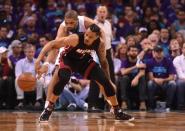 Apr 29, 2016; Charlotte, NC, USA; Miami Heat guard forward Gerald Green (14) gets the ball knocked away by Charlotte Hornets guard forward Nicolas Batum (5) during the first half in game six of the first round of the NBA Playoffs at Time Warner Cable Arena. Mandatory Credit: Sam Sharpe-USA TODAY Sports