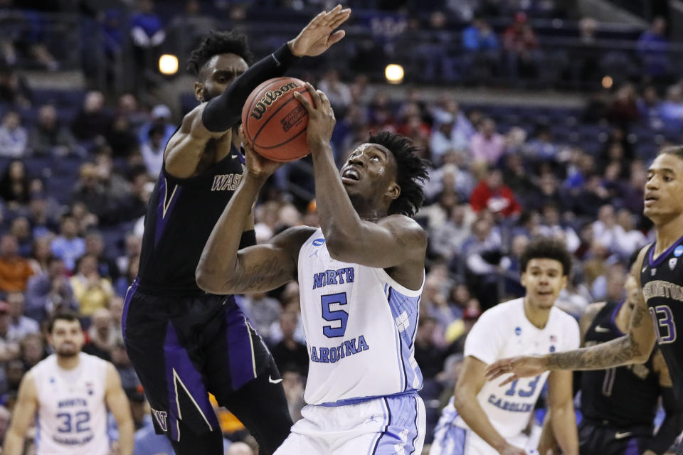 North Carolina's Nassir Little (5) shoots against Washington's Matisse Thybulle, left, during the second half during a second-round men's college basketball game in the NCAA Tournament, Sunday, March 24, 2019, in Columbus, Ohio. (AP Photo/John Minchillo)