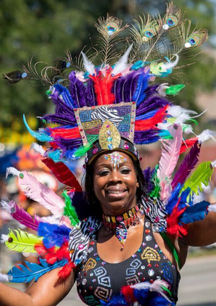 PHOTO: A woman bedecked in feathers marches in the annual Bud Billiken Parade in Chicago, on Aug. 10, 2019. (Xinhua via ZUMA Wire)