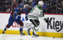 Dallas Stars center Tyler Seguin, right, collects the puck next to Colorado Avalanche center Casey Mittelstadt during the second period of Game 3 of an NHL hockey Stanley Cup playoff series Saturday, May 11, 2024, in Denver. (AP Photo/David Zalubowski)
