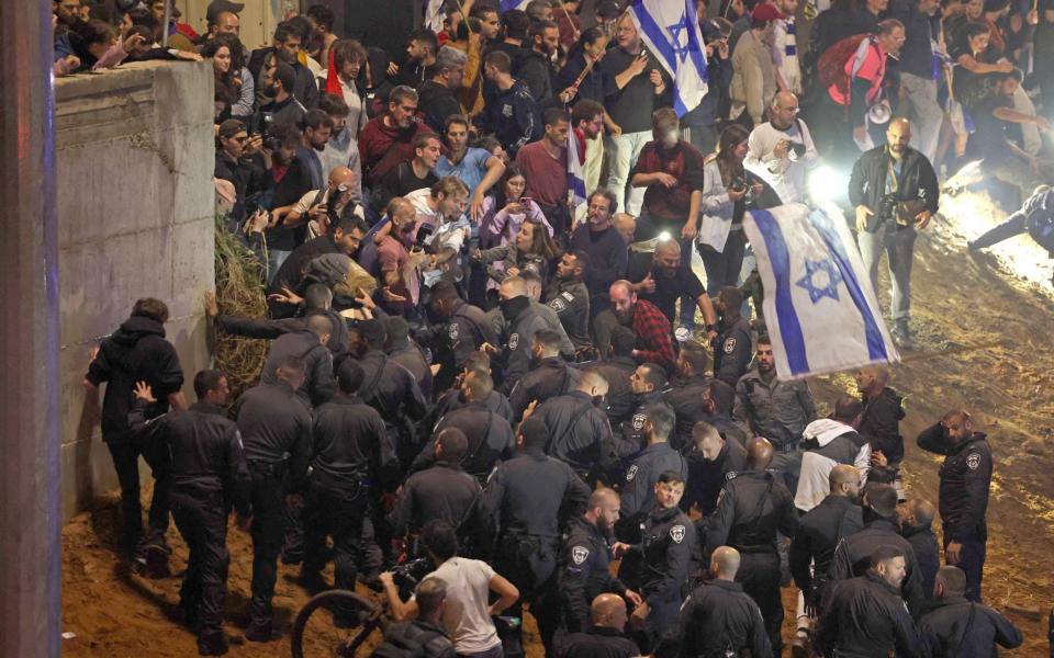 Protesters clash with police in Tel Aviv - AHMAD GHARABLI/AFP via Getty Images