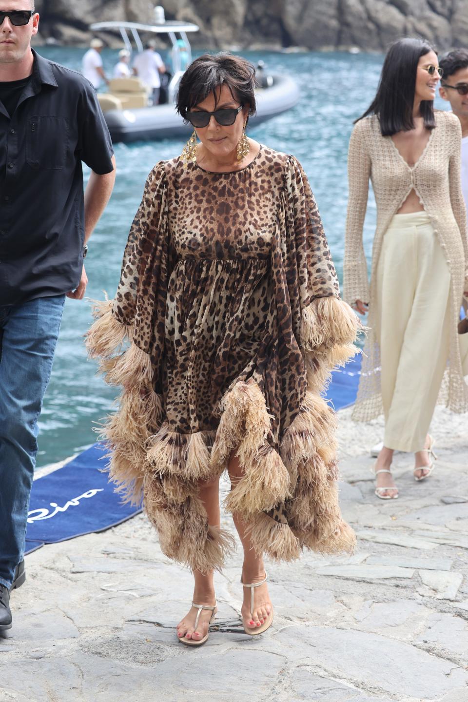 Kris Jenner in a leopard print and feather dress