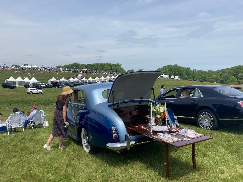 A woman admires a 1956 Rolls-Royce silver Wraith touring limousine owned by Richard Mollett, Taneytown MD at the 45th annual Point to Point, May 7, 2023.