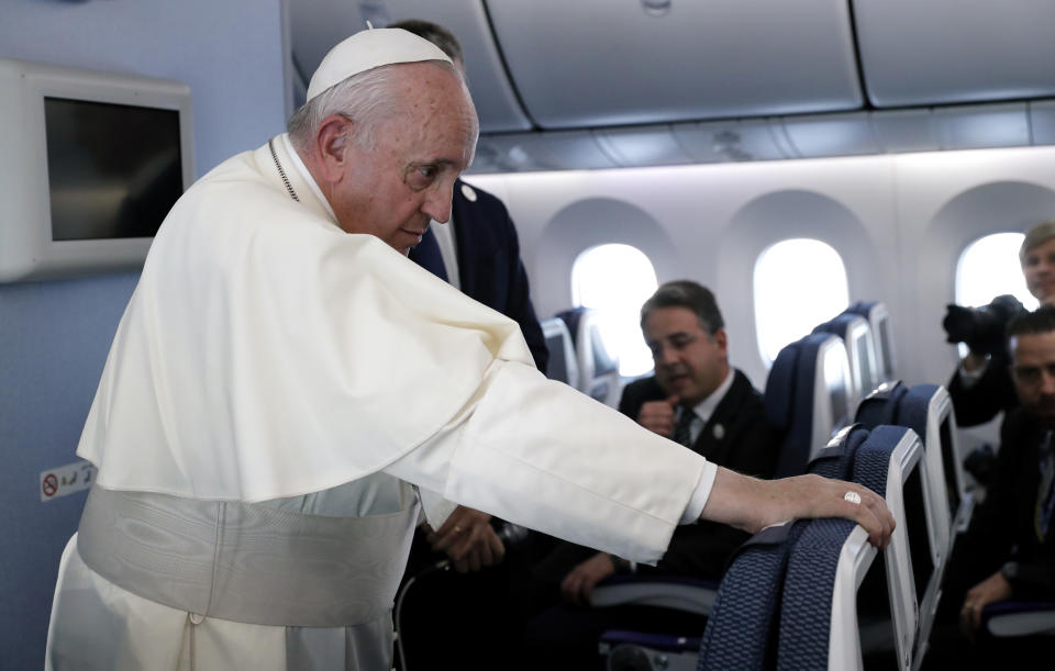 Pope Francis speaks during a news conference onboard the papal plane on his flight back from a trip to Thailand and Japan, Monday, Nov. 26, 2019. (Remo Casilli/Pool Photo via AP)