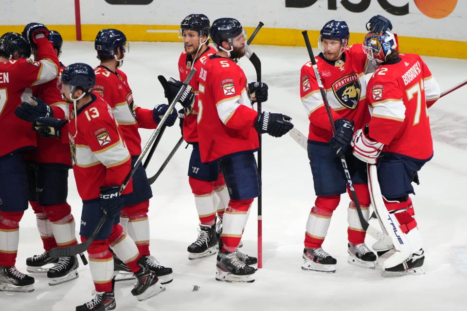 Jun 1, 2024; Sunrise, Florida, USA; Florida Panthers goaltender Sergei Bobrovsky (72) is congratulated by defenseman Gustav Forsling (42) following a close-out victory against the New York Rangers in game six of the Eastern Conference Final of the 2024 Stanley Cup Playoffs at Amerant Bank Arena. Mandatory Credit: Jim Rassol-USA TODAY Sports