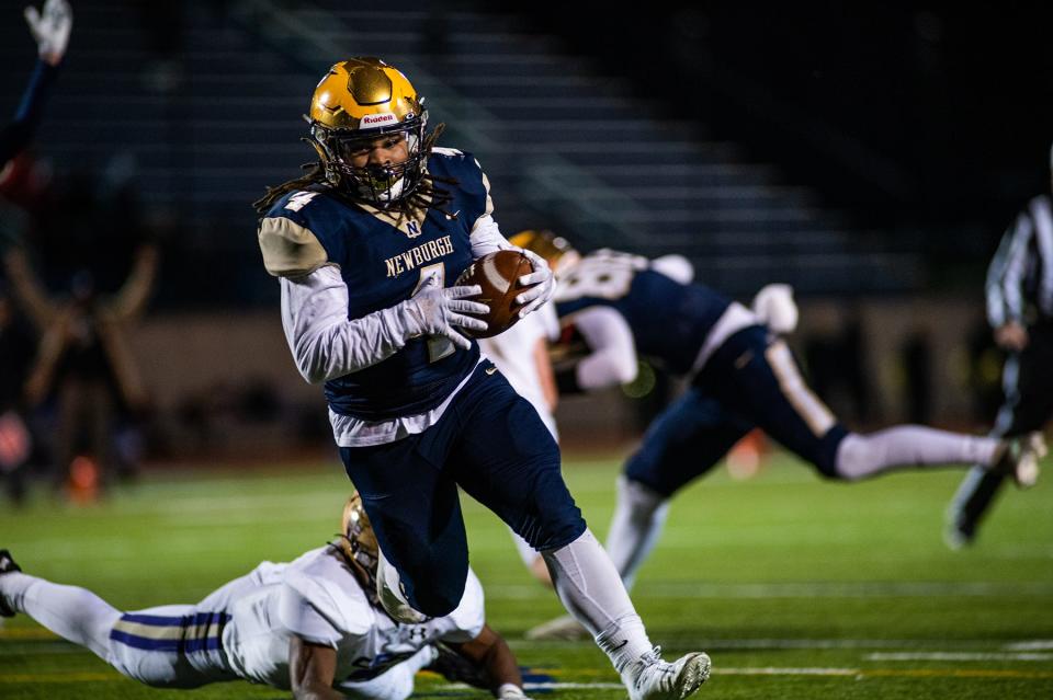 Newburgh's Tajir Walker runs in a touchdown during the NYSPHSAA Class AA semifinall football game in Middletown, NY on Saturday, November 26, 2022. Newburgh defeated Christian Brothers Academy. KELLY MARSH/FOR THE TIMES HERALD-RECORD