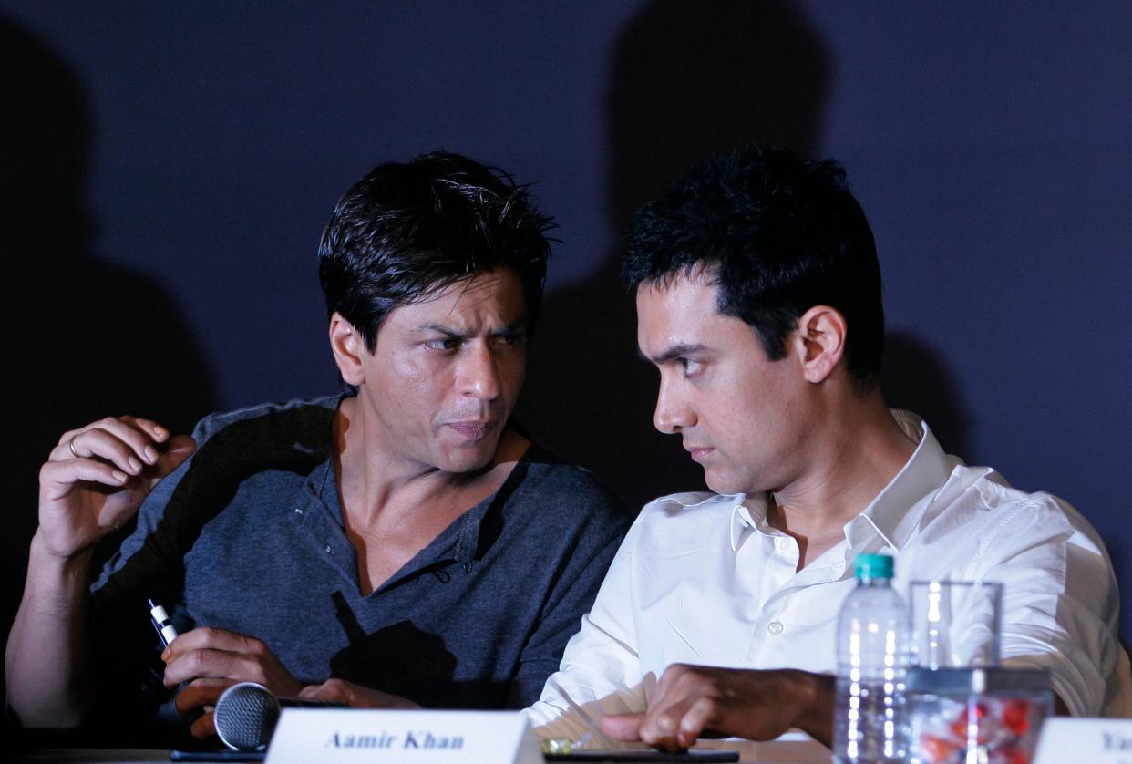 In this April 7, 2009, file photo, Bollywood actors Shah Rukh Khan, left, and Aamir Khan speak during a press conference in Mumbai (Copyright 2020 The Associated Press. All rights reserved.)