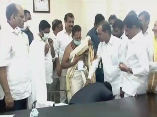 Siddipet collector touching feet of Telangana CM. (Photo/ANI)