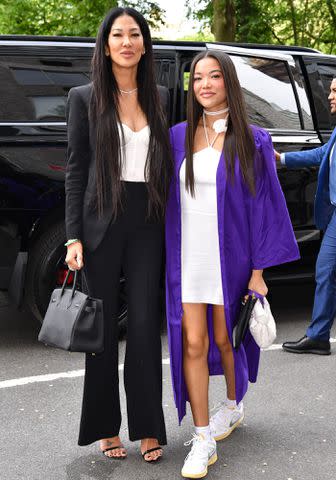 <p>James Devaney/GC Images</p> Kimora Lee Simmons and Ming Lee Simmons after her New York University graduation ceremony