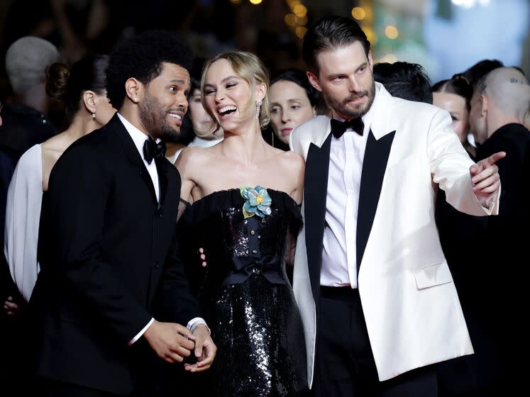 CANNES, FRANCE - MAY 22: (L-R) Abel "The Weeknd" Tesfaye, Lily-Rose Depp and Sam Levinson attend the "The Idol" red carpet during the 76th annual Cannes film festival at Palais des Festivals on May 22, 2023 in Cannes, France. (Photo by Pascal Le Segretain/Getty Images)