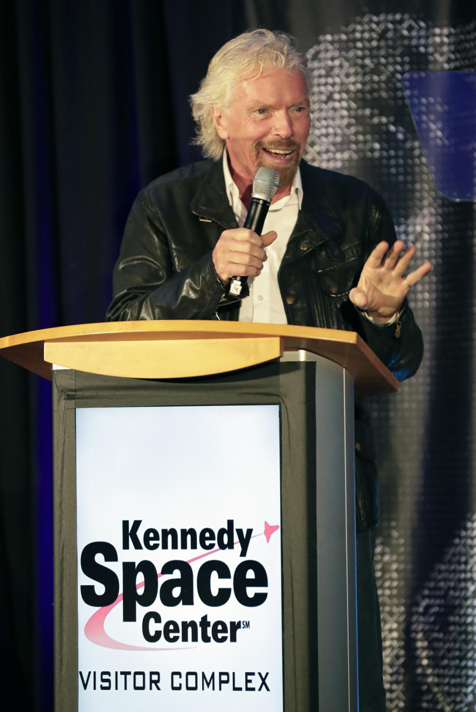 Richard Branson makes remarks during a luncheon attended by 100 Virgin Galactic ticket holders, to mark his 69th birthday and in recognition of the Apollo 11 moon landing anniversary at the Kennedy Space Center Visitor Complex, Thursday, July 18, 2019, in Cape Canaveral, Fla. (AP Photo/John Raoux)