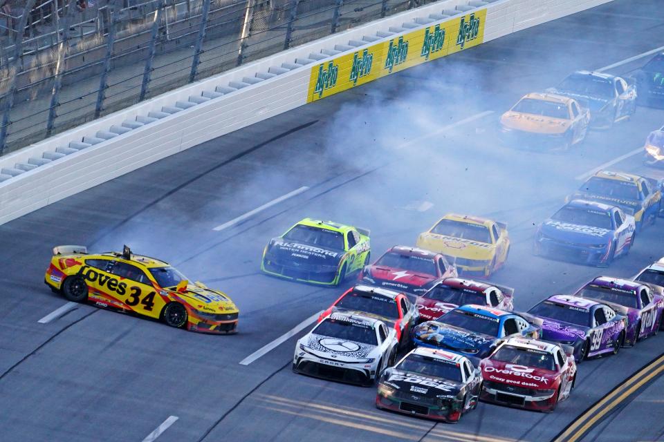 Apr 21, 2024; Talladega, Alabama, USA; NASCAR Cup Series driver Michael McDowell (34) wrecks on the last lap during the GEICO 500 at Talladega Superspeedway. Mandatory Credit: John David Mercer-USA TODAY Sports